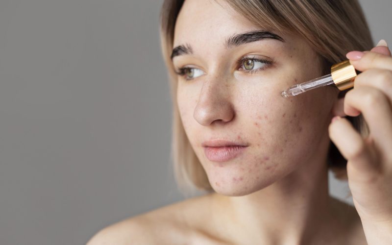 close-up-woman-using-serum